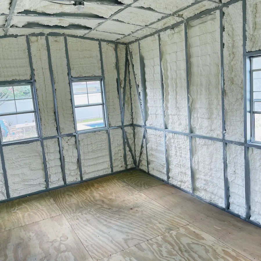 Closed-cell spray foam insulation applied to wall cavities in a residential project in Lutz